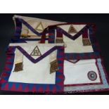 A Knight's Templar gown and cloak together with a collection of Masonic aprons from lodges in