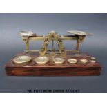 A Mordan set of postage scales with weights to base including two weights marked F (pre 1851)