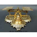 A Townsend & Co brass letter scale with cast base and weights to front marked to underside with