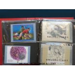 Four albums of first day covers,