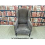 A 19thC club or wing back upholstered chair