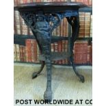 A cast iron Britannia pub table