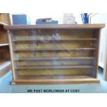 A pine display cabinet, previously used for models (W96 D15.