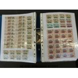 A large quantity of all world stamps in three ring binders