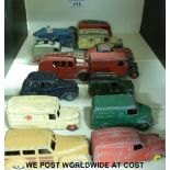 Fourteen Dinky Toys diecast model vehicles including delivery vans, racing car, fire engine,