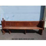 A 19thC carved pine pew (length 241cm)