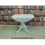 A contemporary painted kitchen table (diameter 90cm,
