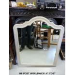 A pair of black framed mirrors with bevelled glass (96 x 66cm) together with a further mirror