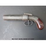 A replica Coopers Patent pepperbox revolver with shaped wooden grips, ornate engraving and 4.