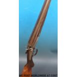 A deactivated Graham 12-bore double barrelled side by side shotgun with engraved decoration,