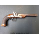 A 25 bore percussion hammer-action target pistol with chequered, carved and beaded grip,