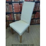 Four cream leather modern dining chairs