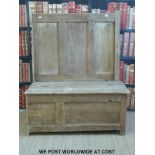 A pine settle with panelled front and back (W96 D50 H116cm)