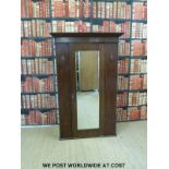 A small oak wardrobe with bevelled glass mirror (W104 D48 H161cm)