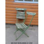Four vintage wooden-seated folding garden chairs