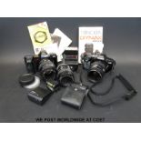 A collection of vintage cameras including Minolta, Dyrax 7000i, Dyrax 3000i,