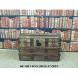 A 19thC metal and ash bound domed trunk with carrying handles (W85 D50 H57cm)