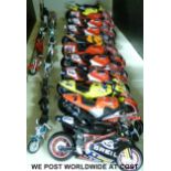 Twenty-two model motorbikes of various scales,