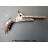 Double barrelled side by side pinfire hammer action pistol with carved grip, engraved locks,