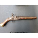 Flintlock hammer action holster pistol with engraved brass mounts,