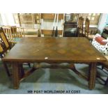 An oak extending dining table and nine chairs (minimum length of table 160cm, maximum 260,