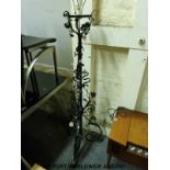 A floral metal standard lamp in the manner of Benson,