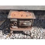 A cast iron barge stove/range "The Doctress" (width 54cm) and various other metalware