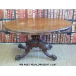 A mahogany oval topped breakfast table with carved four legged base (max diameter 133,