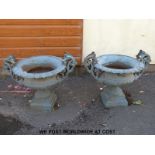 A pair of cast iron garden urns or planters (width 81cm,