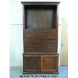 A large oak filing/TV cabinet with tambour style top section (W130 D44 H251cm)