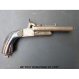 Double barrelled side by side pinfire hammer action pistol with carved grip, engraved locks,