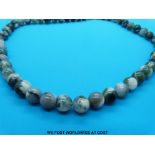 A collection of beaded necklaces to include moss agate, sunstone,