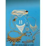 A collection of costume jewellery to include necklaces, watches, silver bracelet,