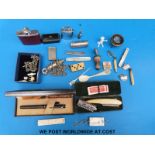 A quantity of items to include whistle, lighter, hip flask, vesta case, seal,