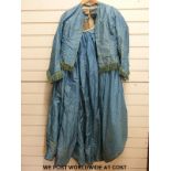 A Victorian blue silk skirt and matching jacket / bodice with green ribbon and thread trim