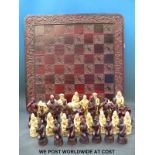 A chess set with moulded figures representing Drake and the Elizabethans against the Spanish