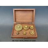 A boxed set of vintage brass weights 16oz - ½oz