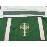 A finely embroidered altar cloth with foliate embroidery on a green ground and gold cross