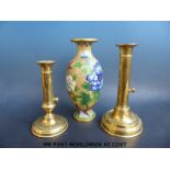 Two brass ejector candlesticks and a cloisonné vase with floral and butterfly decoration (23cm