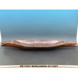 A tribal elongated hardwood bowl (length 94cm)