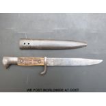 A stag's horn handled trench knife, probably German, in metal sheath,