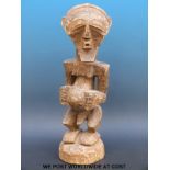 An African tribal maternity figure of a pregnant woman (44cm tall)