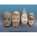 Four African tribal masks (largest 32cm)