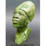 A carved soapstone African or tribal bust, marked 'by A.R.