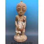 An African tribal maternity figure of a pregnant woman,