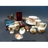 A small collection of items to include crested ware, cased horseshoe themed studs, insect brooch,