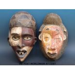 Two African tribal masks with painted decoration (largest 36cm)