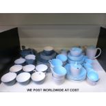 Two Poole pottery tea sets with milk jugs,