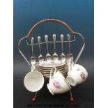 A retro bone china tea set on metal stand with teaspoons