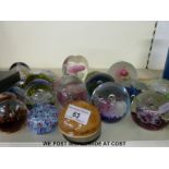 A large collection of glass paperweights including Caithness 2002, Raindrop, Totnes, Selkirk,